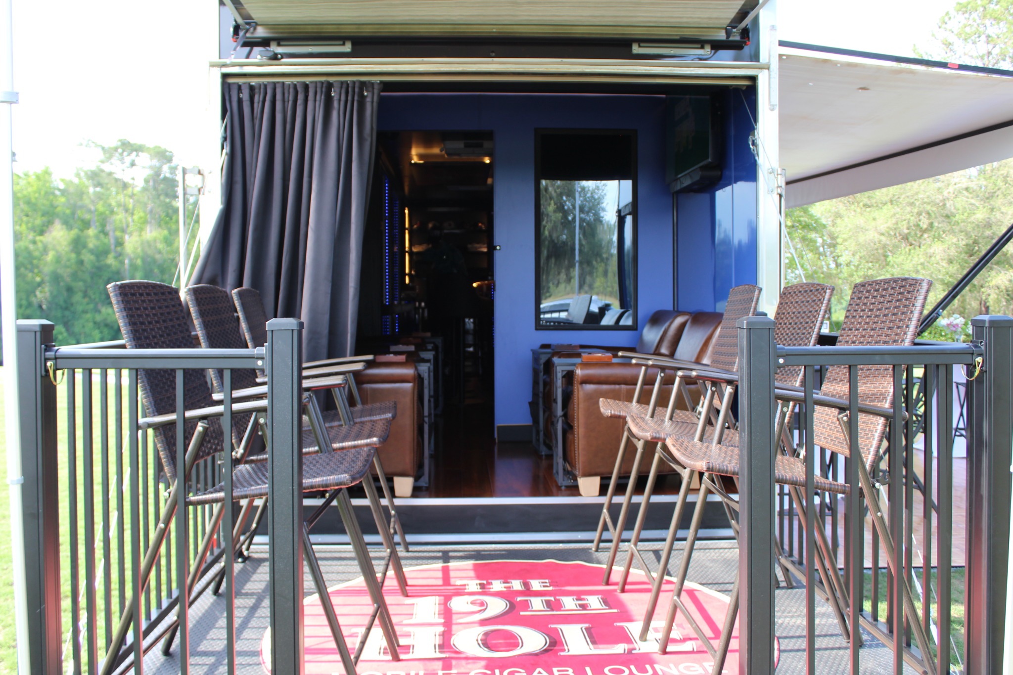 Rear deck and entrance of The 19th Hole Experience at a real event
