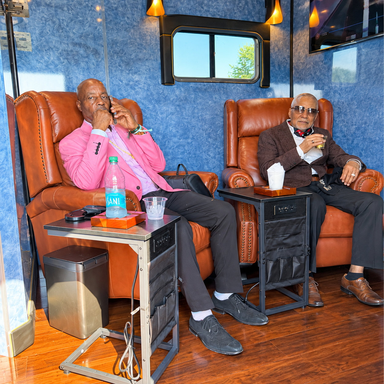 Guests inside The 19th Hole Experience mobile hospitality lounge